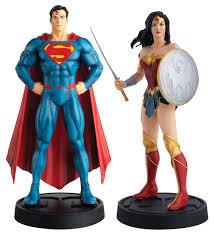 Superman & Wonder Woman Figurines with Special Edition Guide